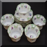 P75. Set of 5 porcelain dessert bowls with saucers. - $20 